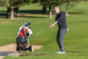 Student golfer on the course