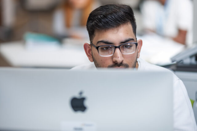 Student working on mac computer