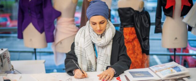 Fashion student looking at samples