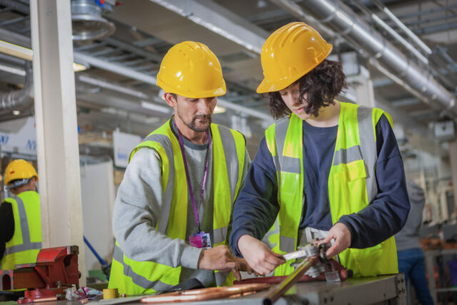 Students working with pipes