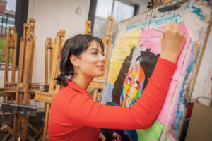 Student creating a poster
