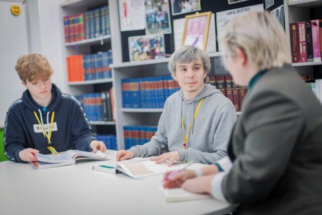 Students working around a table