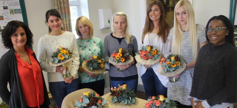 florist students with arrangements