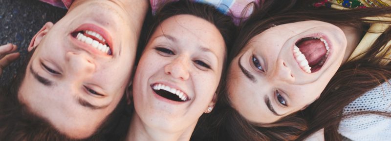 students laying down laughing