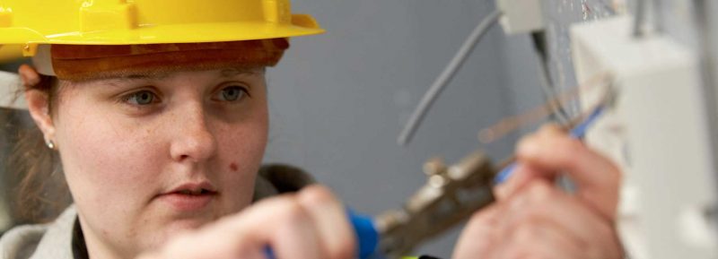 Female Student studying electrical at James Watt college