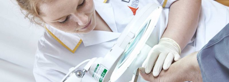 Podiatry student working on patient