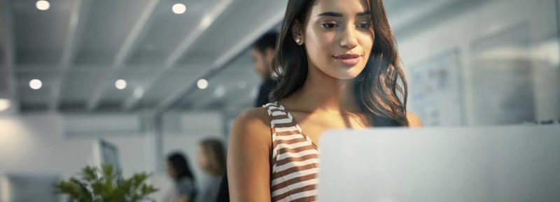 young careers lady sat at computer