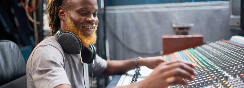 adult student working in the music studio