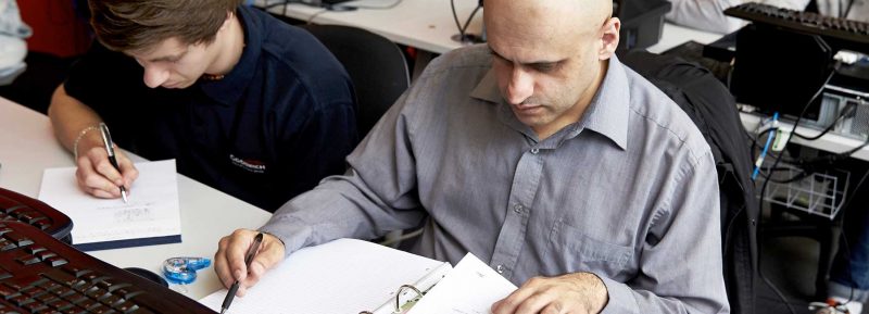 adult learners working in classroom