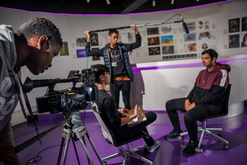 Students filming an interview