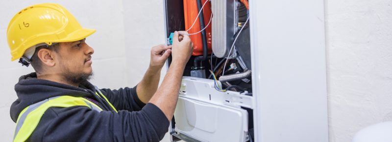Gas Engineer Student working on boiler