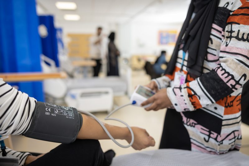 Students taking blood pressure