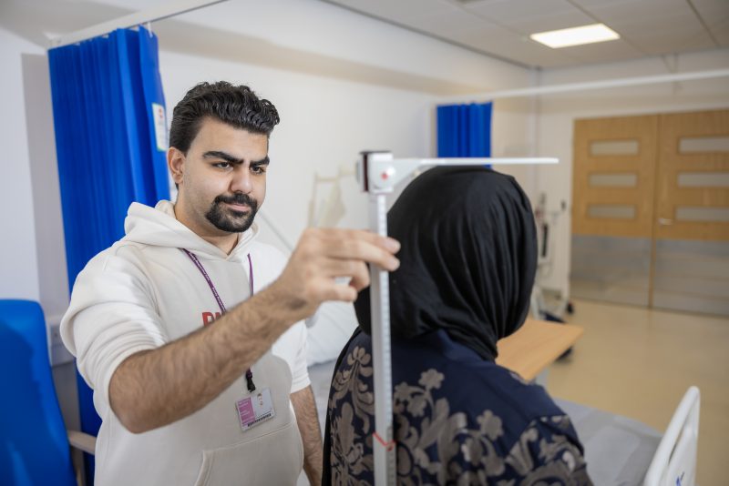 Students in clinic measuring height