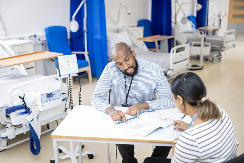 Student and teacher working in clinic