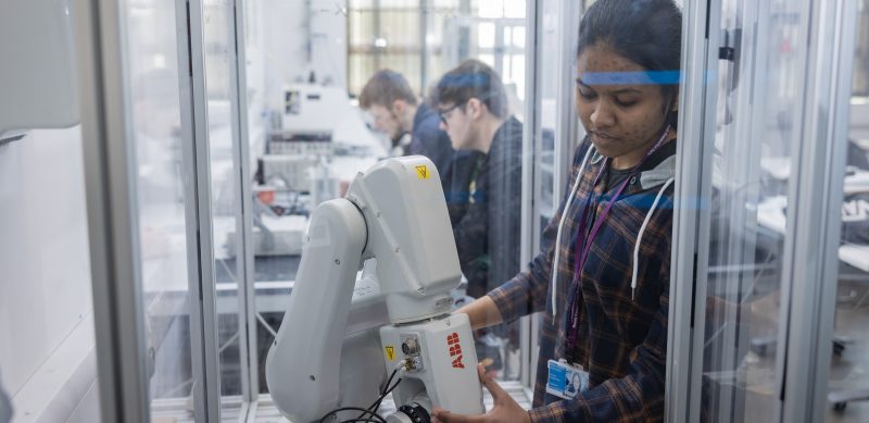 Female engineering students with robotics